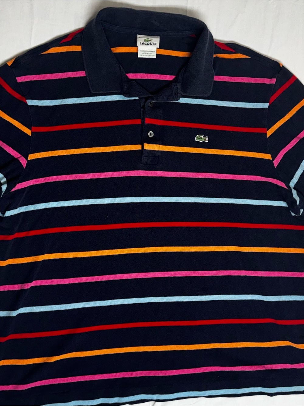 Lacoste Navy Polo with Red, Pink, Light Blue & Orange Stripes